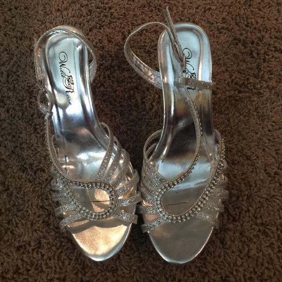 Silver heels have wear on them. See pictures. - Picture 1 of 4