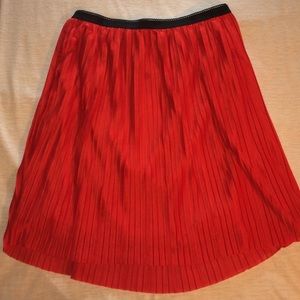 Red pleated skirt
