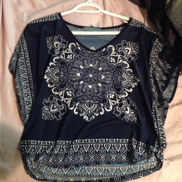 Blue patterned silk top.