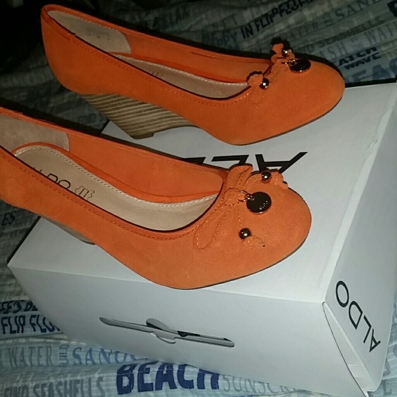 Orange wedge heels