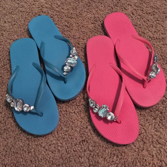 Two pairs of rhinestone flip flops