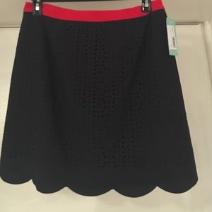 Navy skirt with scalloped detailing on the bottom!