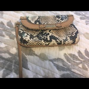 Snakeskin print wristlet by Jessica Simpson