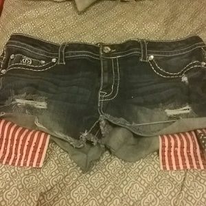 Denim shorts with American flag pockets