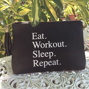Black clutch or make-up bag.