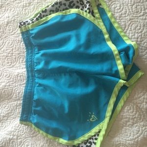 Sporty blue and green shorts with cheetah print