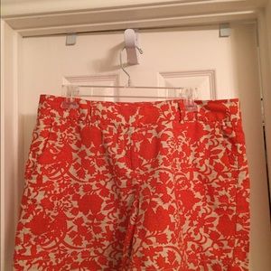 Orange and beige leaf print shorts