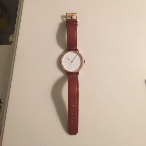 Nixon watch with brown leather band and rose gold.