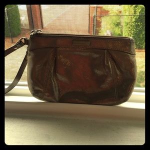 Gold shimmer coach wristlet.