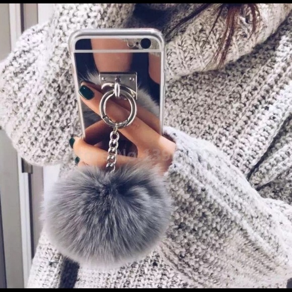 iPhone case with fur tassel.