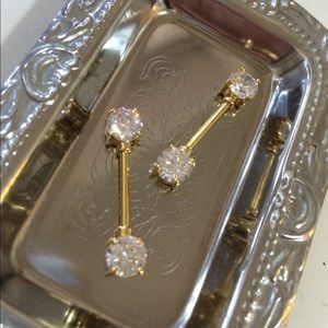 Gold and CZ nipple rings bars.