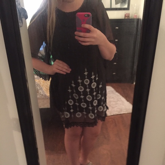 Black dress with lace and embroidered detail