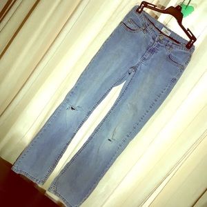 Girls soft, light-colored ripped jeans.