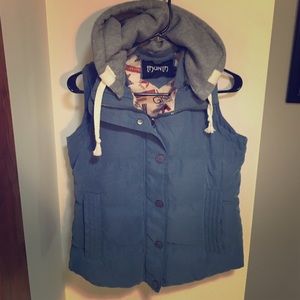 Blue puffy vest with detachable cotton hood.