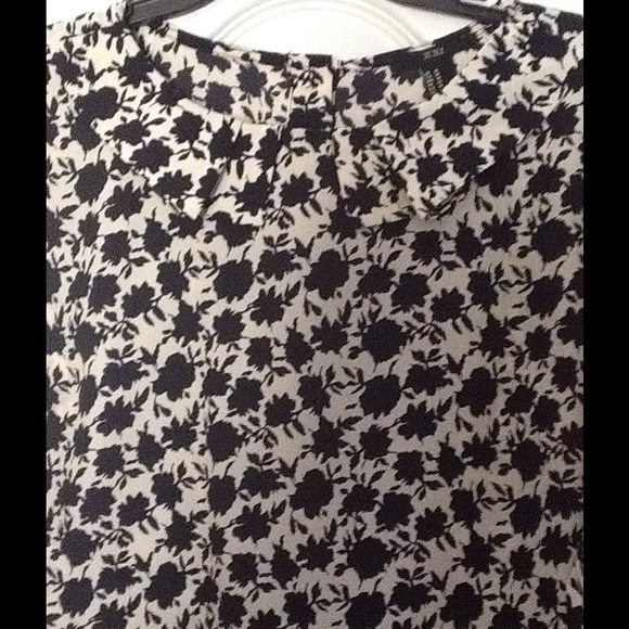 Floral Blouse navy and off white buttons in back.