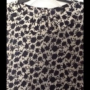 Floral Blouse navy and off white buttons in back.