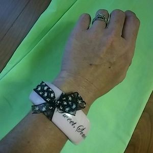 Pink and black skull crossbone bow bracelet...