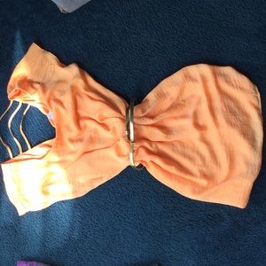 Super cute orange dress with a gold belt