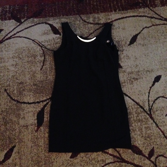 Black form fitting dress with gold band