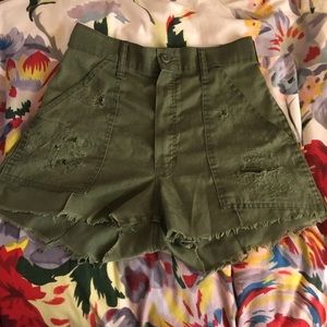 Green high waisted distressed shorts