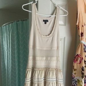 BeBe Large dress stretch and well kept. Tan color