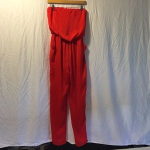 Red strapless ASTR jumpsuit with pockets