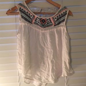 Cute summer tank top with embroidered front.