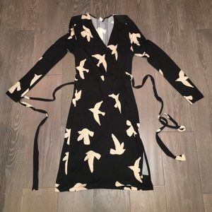 Black and tan wrap dress with bird print