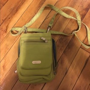 Cross body Baggallini purse full of pockets