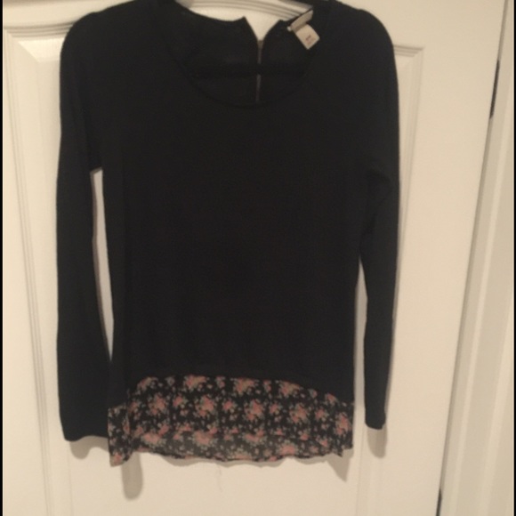 Black top with floral appliqué