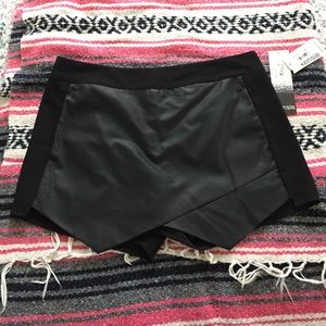Kensie asymmetrical hem skort with faux leather