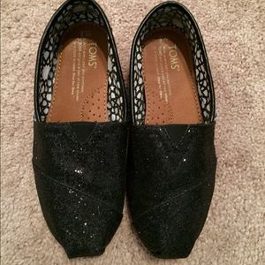 Pair of TOM'S sparkly black slip-ons, SZ5