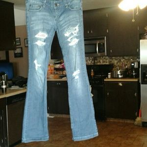 Womans jeans size 27 very small stain on leg