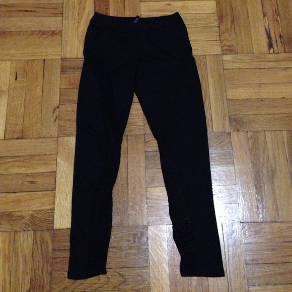 Black leggings with see through panels on each leg