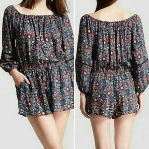 Off-shoulder navy floral romper