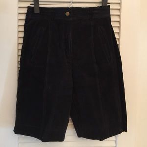 Vintage black leather shorts with nylon lining.