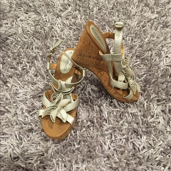 Gold leather flowers on top, cork wedge.