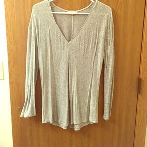Gray v-neck long sleeve.