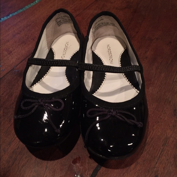 Black patent leather ballet style shoes