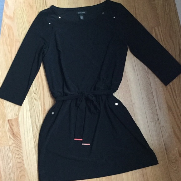 Black three-quarter sleeve length mini dress.