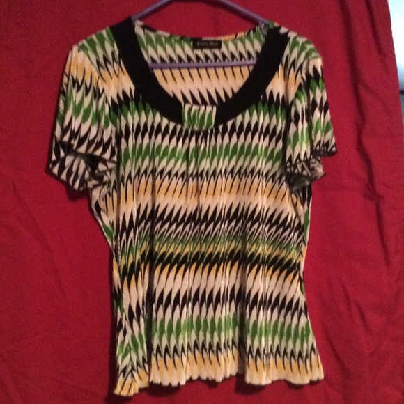 Green, black, yellow and white top.