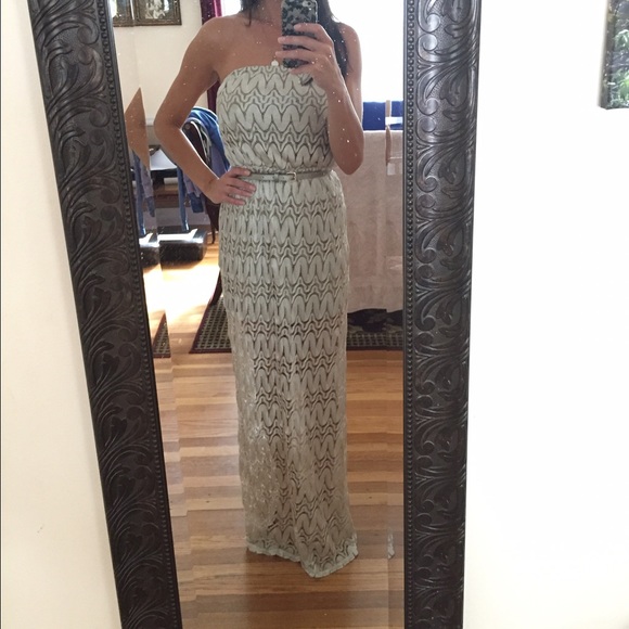 Long strapless summer dress with belt.