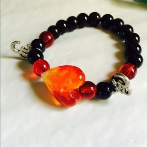om bracelet with heart bead