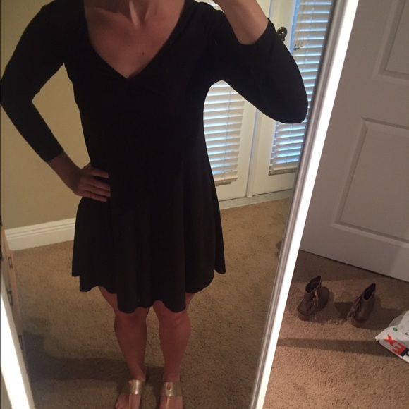 Black dress with fitted sleeves. Small