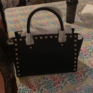 Michael Kors never used original tags still on