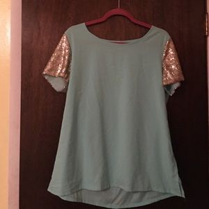 Light blue top with gold sleeves