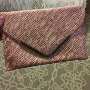 Snake skin pink clutch