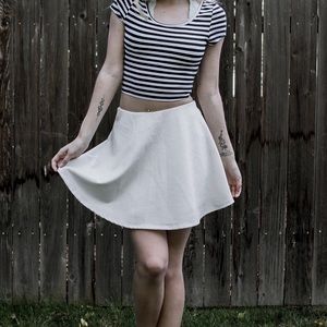 Cream skirt.