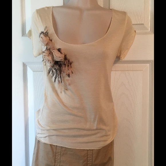 Anthropologie flower embellished top.