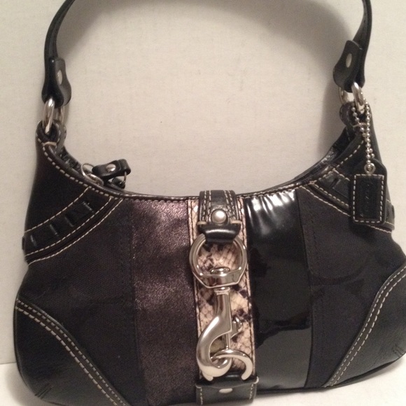 Blk Coach purse with silver colored hard wear.